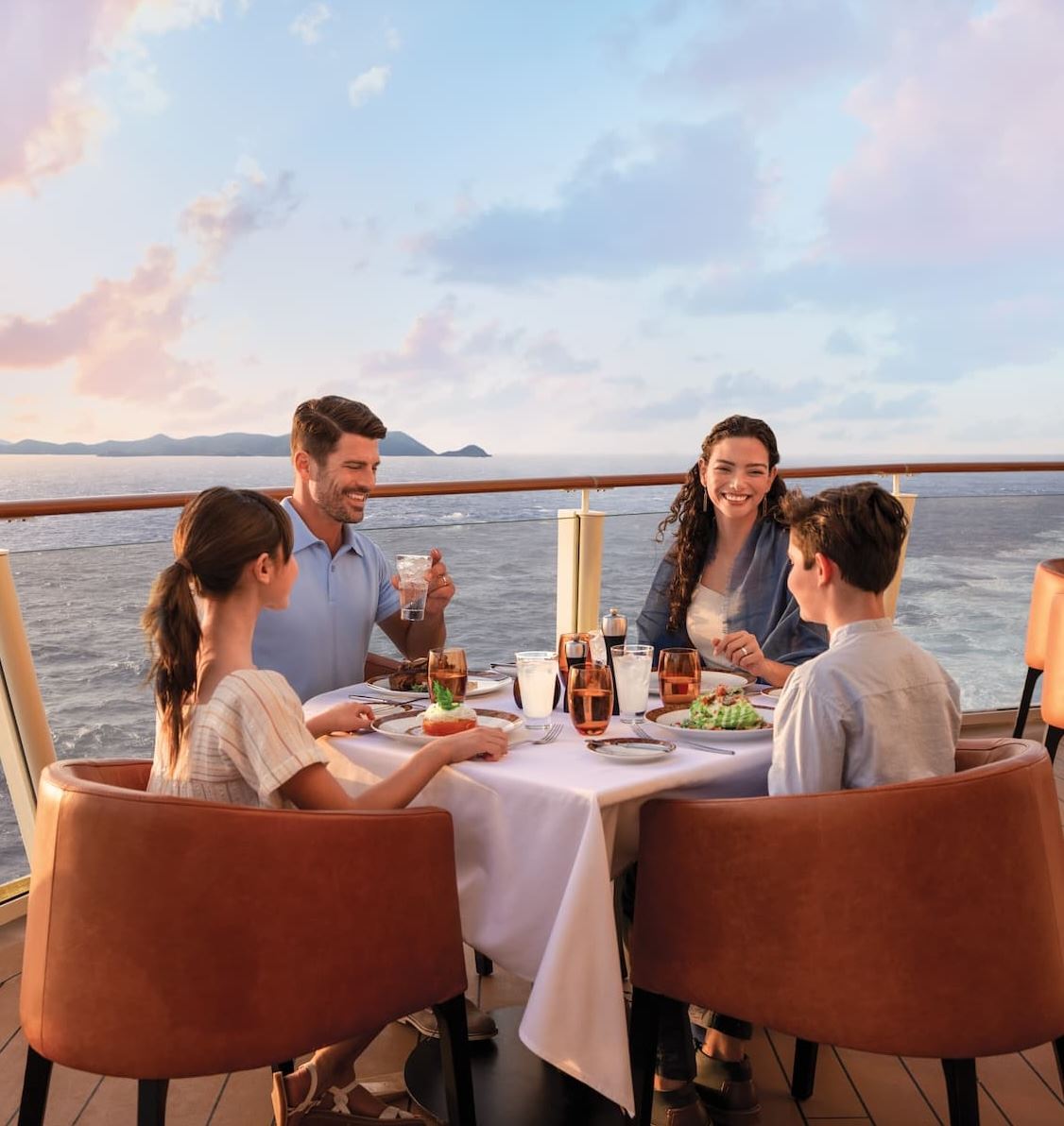 Guests dining outdoors onboard